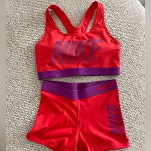Red orange and purple Nike short and sports bra set